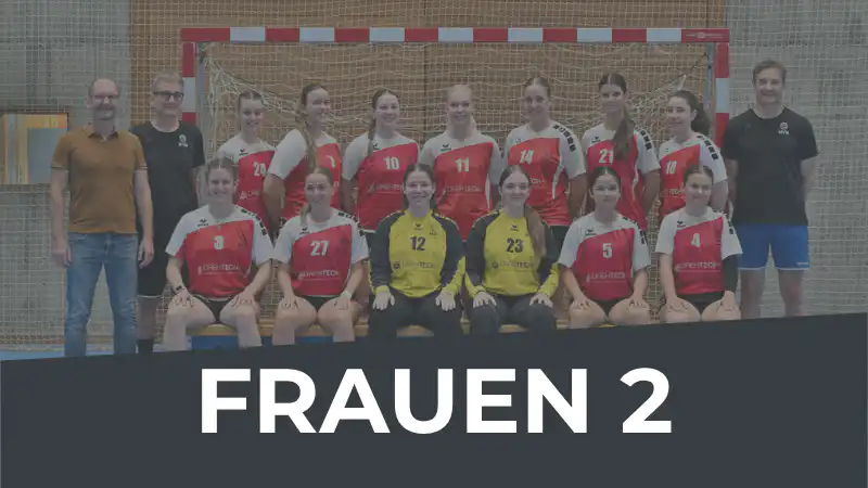 Group photo of a women's handball team in red-white jerseys with two yellow-jersey goalkeepers, posing in a gym, coaches on sides, 'FRAUEN 2' banner overlayed at bottom