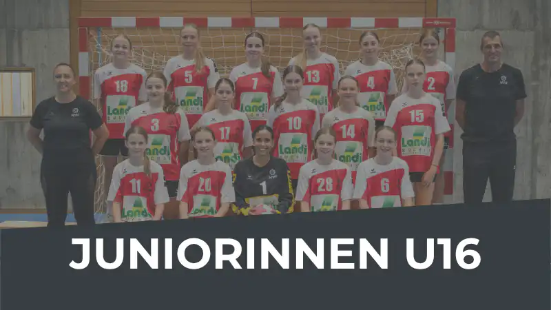 Group photo of a girls' U16 handball team with two coaches in red-and-white jerseys, posing in a gym; banner reads JUNIORINNEN U16.